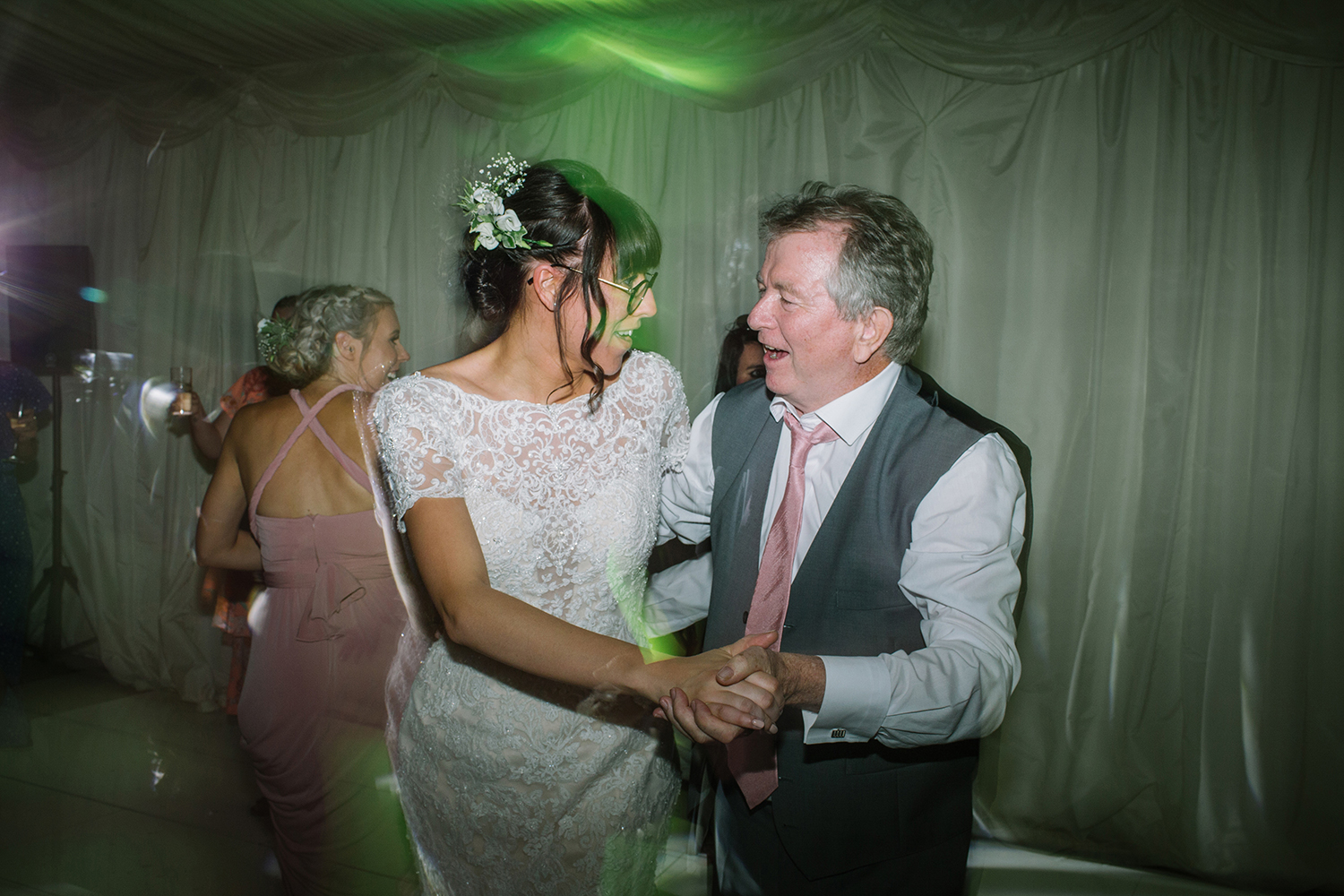 Bride dancing with guests