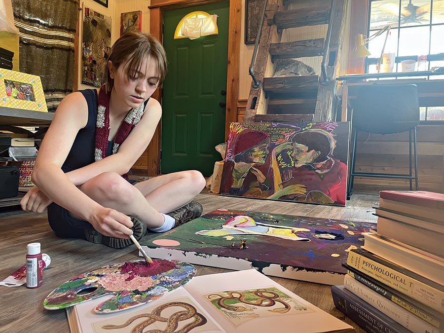  Zoe Ishee paints at the MacGown Art Retreat and Studio. 