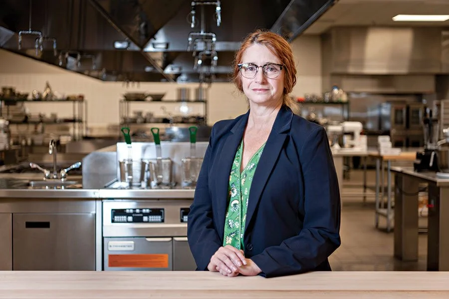  Culinary Arts Institute Director Dr. Tracee Watkins stands in one of the school’s new instruction rooms. 