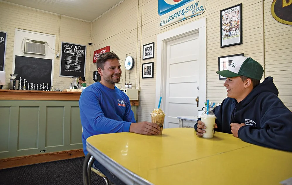 Bryan Boese and Forrest Ensz enjoy a caramel frappe and frozen lemonade at Blue Truck Coffee in downtown Macon.