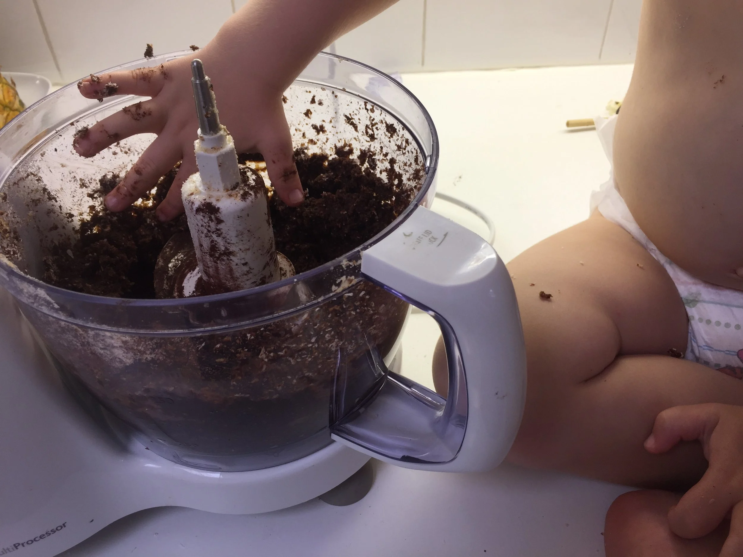 lachie_dipping_finger_in_bowl.jpg