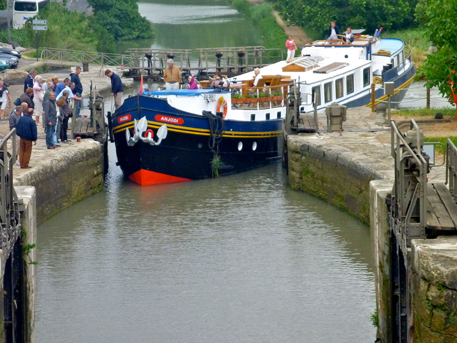A pleasure boat negotiates the UNESCO Heritage 17th-century Canal du Midi