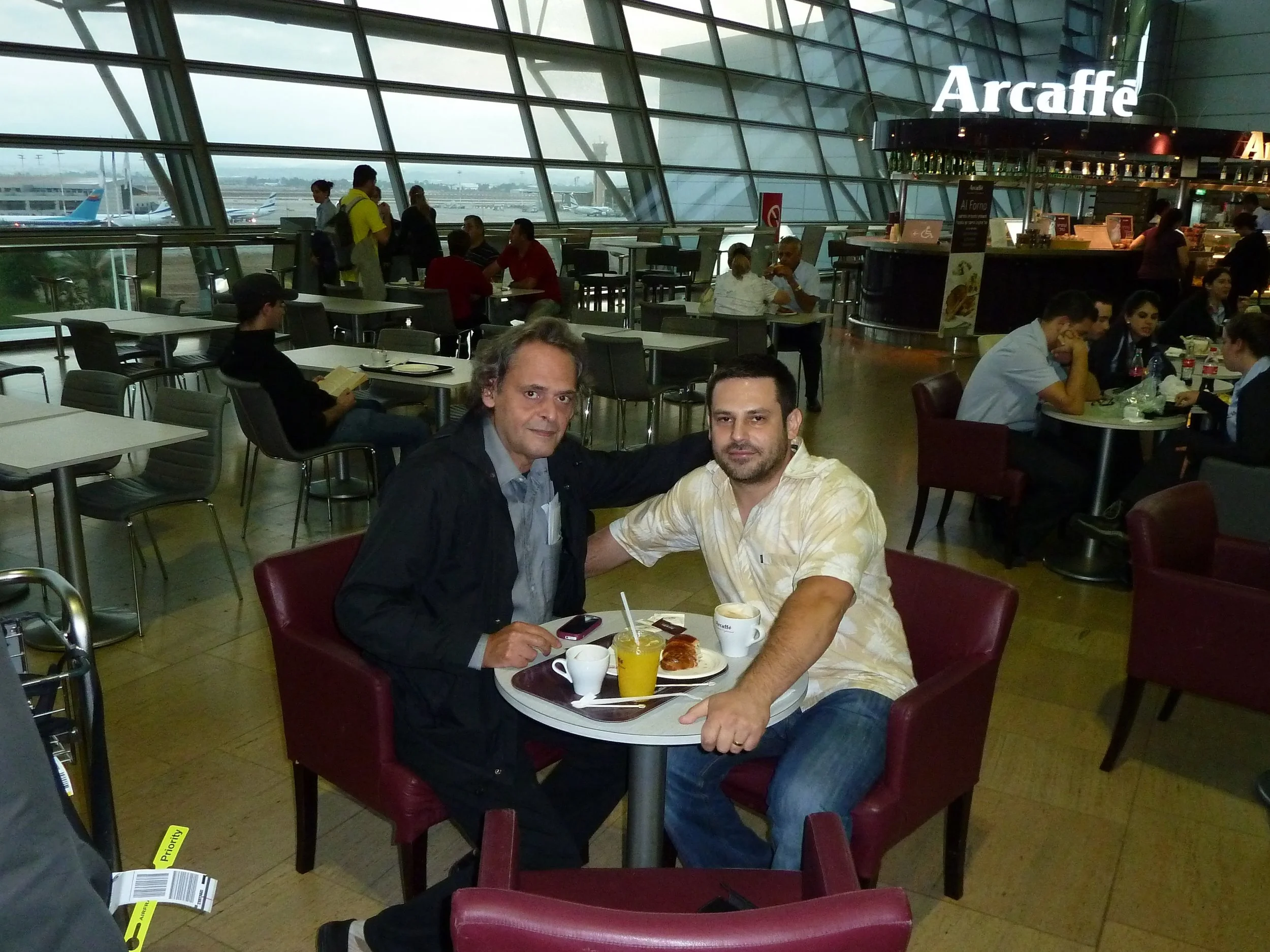 Travelling with Roland Dyens and having coffee on his birthday at Ben Gurion airport, Israel, October 2011