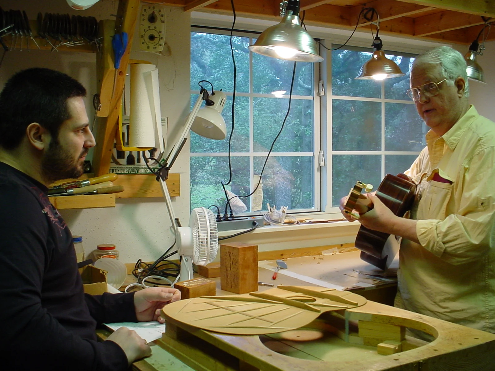 Legendary (truly "Guitar Einstein") Tom Blackshear in his workshop in San Antonio, TX, 2009, where I spent many days studying with him and understanding physics and mechanics of guitar