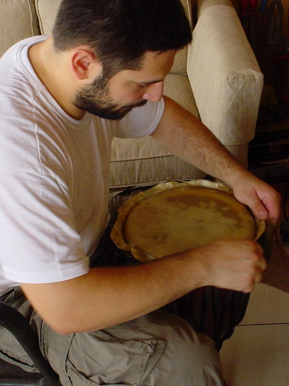 Placing a goat skin on Djembe, Jerusalem, Israel, 2003