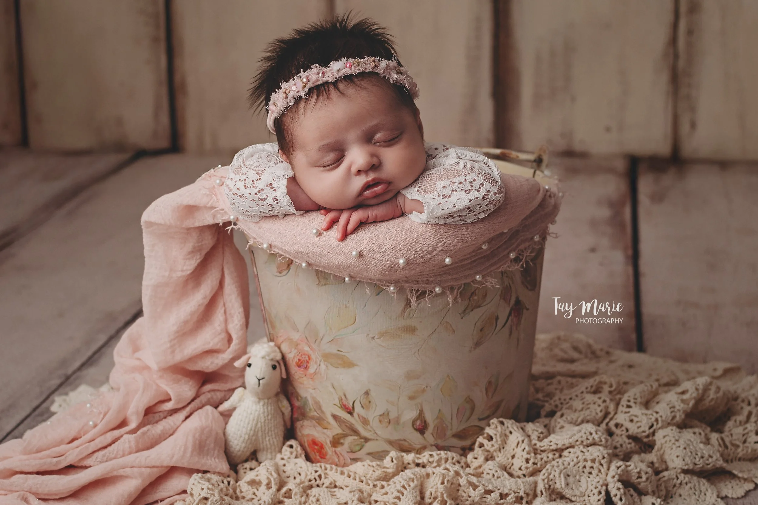 Baby in pink floral bucket