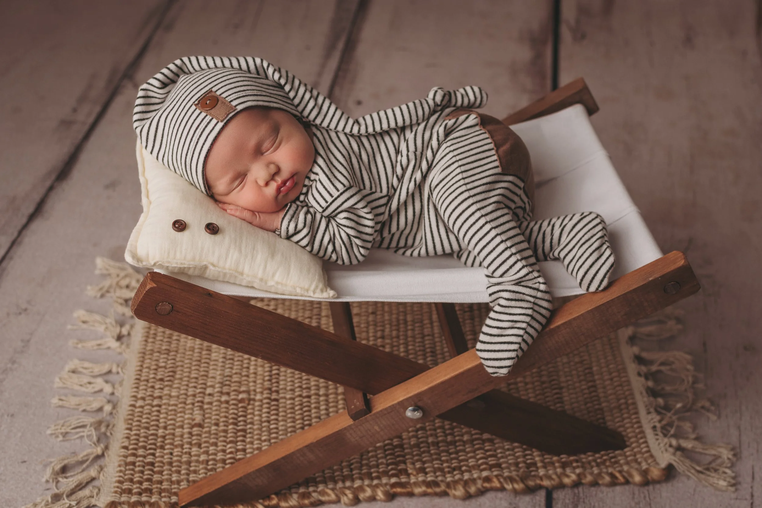 Baby posed on cot