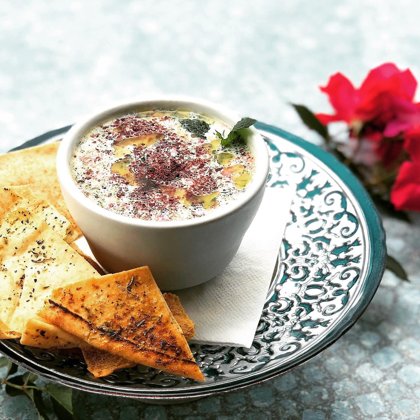 Cool down with our Chilled Persian Soup.  Made with low fat yogurt, walnuts, dried rose petals, golden raisins, chives, cucumber, fresh mint, fresh dill, sumac, and pepper. 😋yum! Cold, summer soup.

#baladimediterraneancafe #baladi #afewsimpleingred