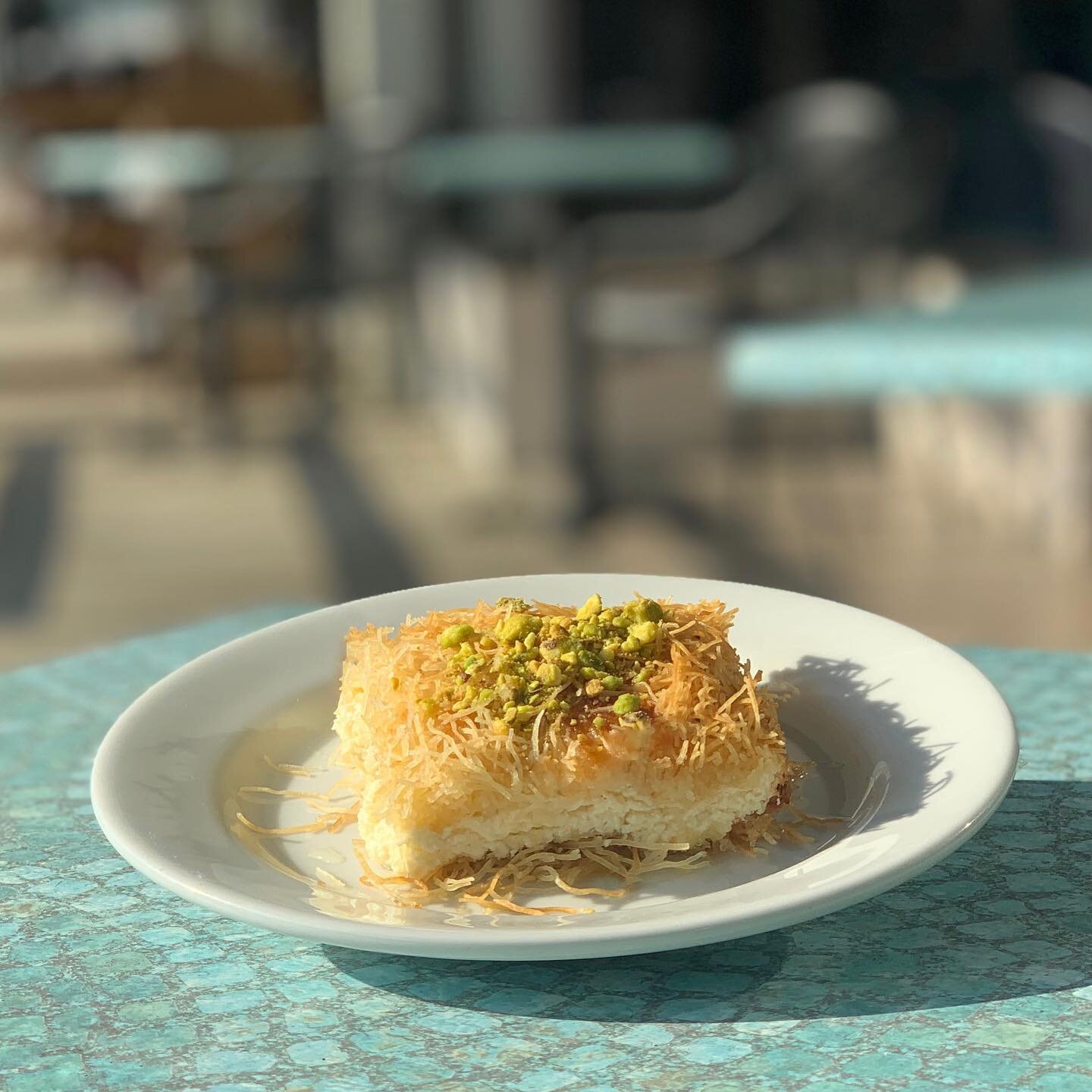 Fresh homemade Kunafah ready!

Come enjoy a slice of our shredded filo dough pastry stuffed with semi-sweet cheese. Topped with rose water organic simple syrup and pistachios. 
&bull;
&bull;
&bull;
&bull;
&bull;
#baladimediterraneancafe #Baladi #leba