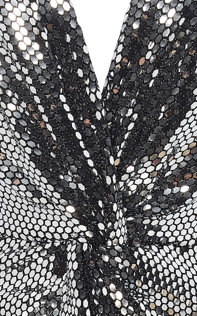 closeup of metallic and black fabric at knot detail