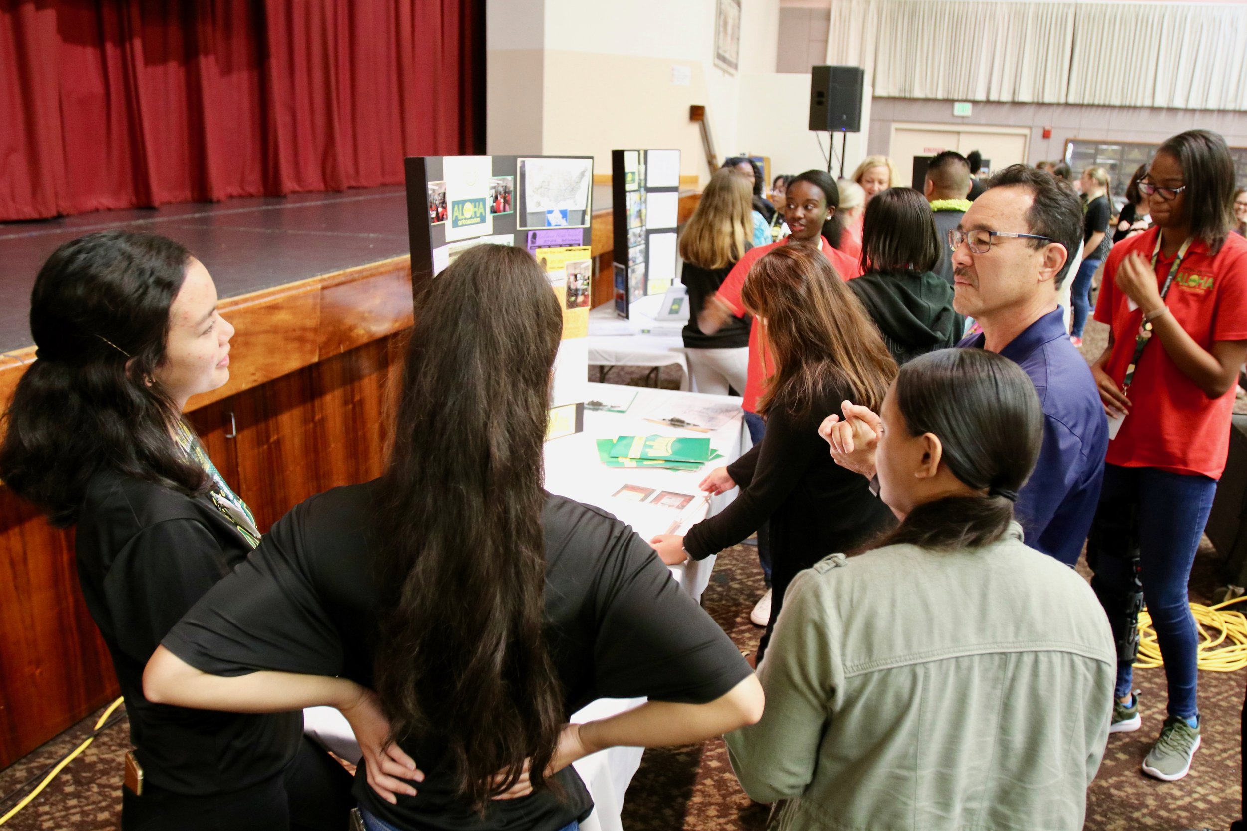 Leilehua High School student ambassadors share their transition center’s program with intrigued listeners. (Copy)