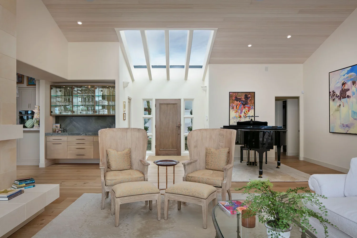 Interior_of_Carmel_on_the_Sand_House_Showing_Living_Space_With_Light_Wood_Finishes_and_Piano.webp