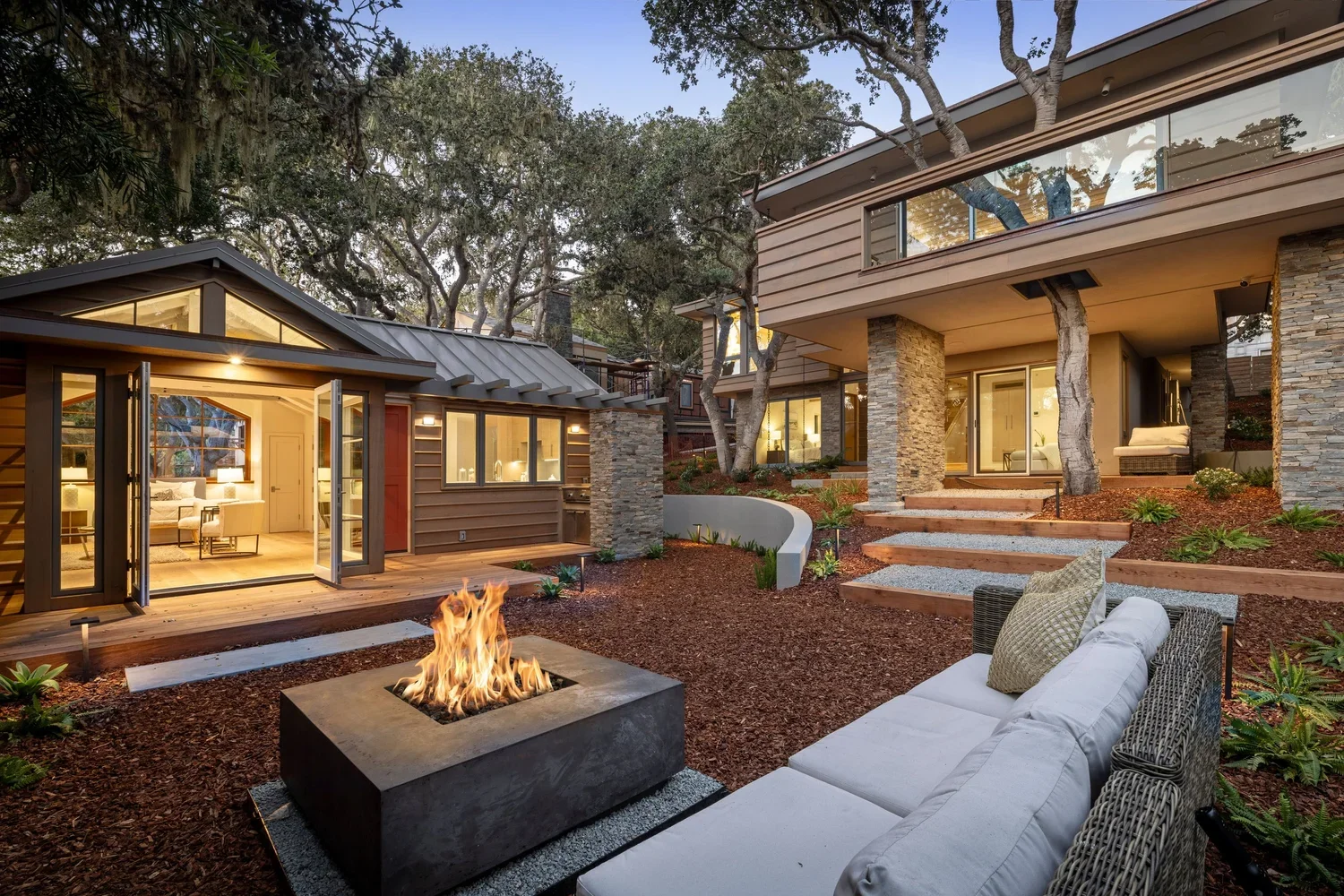 Exterior_of_Feels_Wright_House_Showing_Outdoor_Living_Space_With_Fireplace_ADU_and_Main_Home.webp