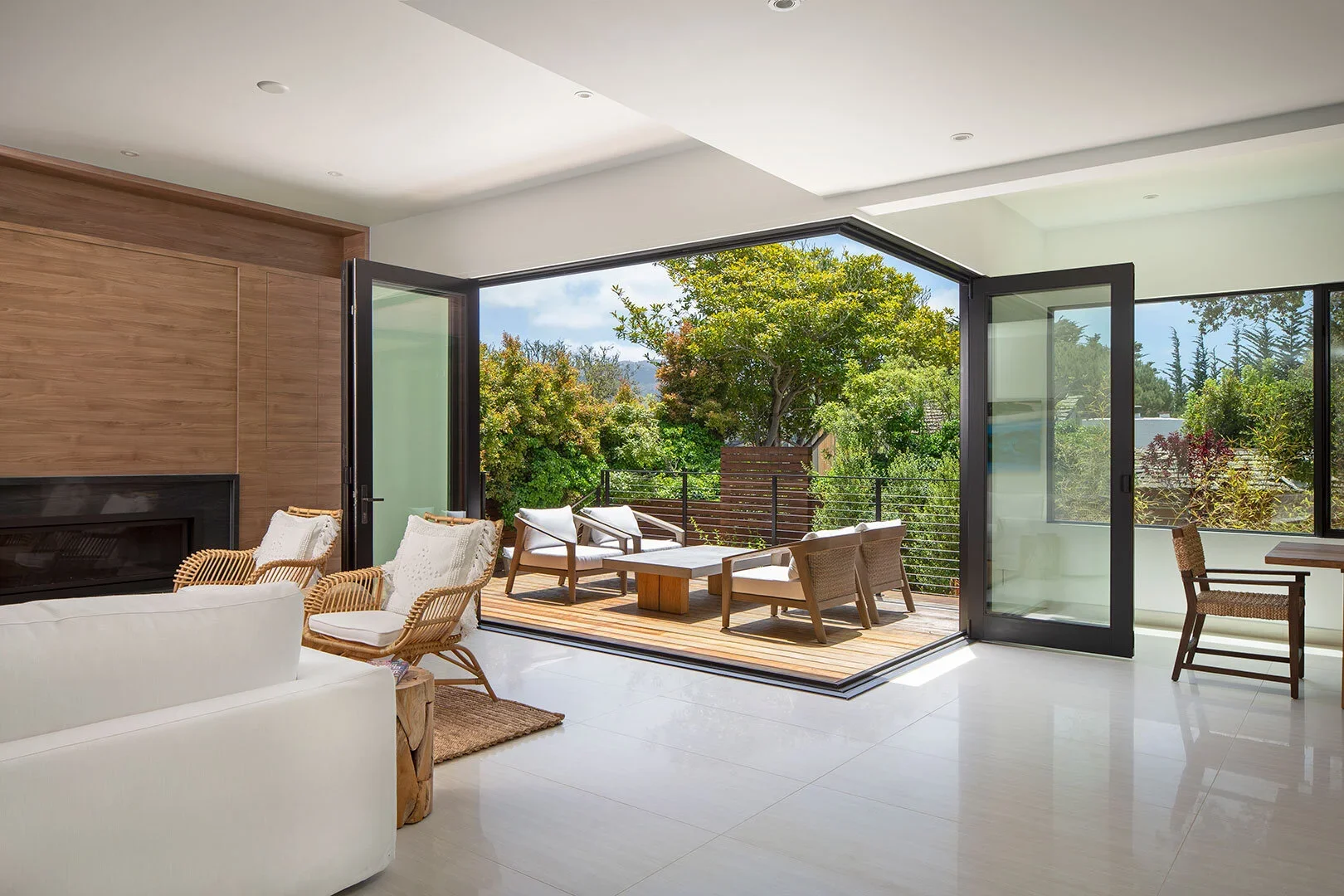 Interior_of_Carmel_Modern_House_Showing_Living_Space_With_Corner_Glass_Doors_That_Fully_Open_to_Patio.webp