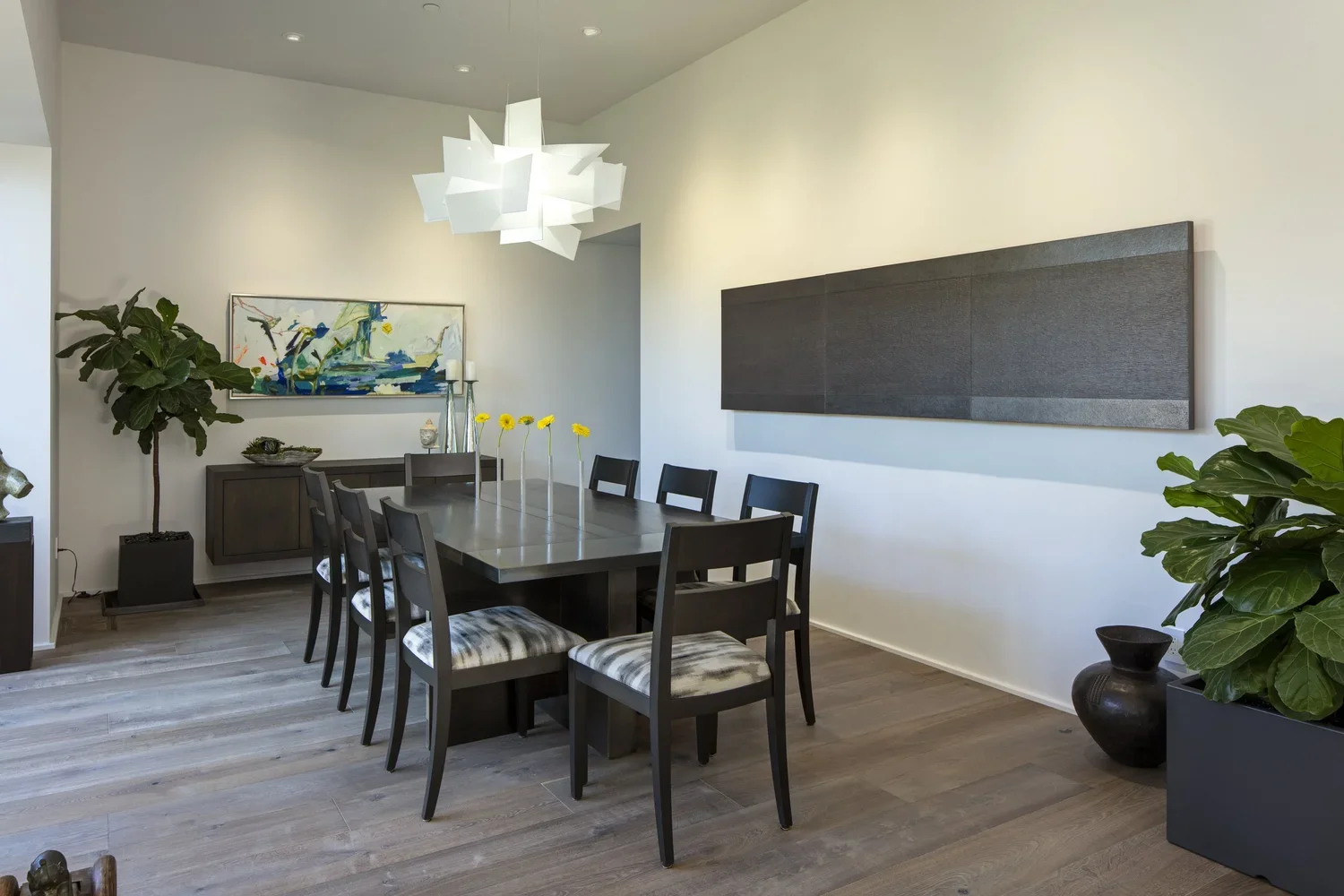 Interior_of_Pebble_Beach_Contemporary_House_Showing_Dining_Space_with_Abstract_Crystal_Chandelier.webp