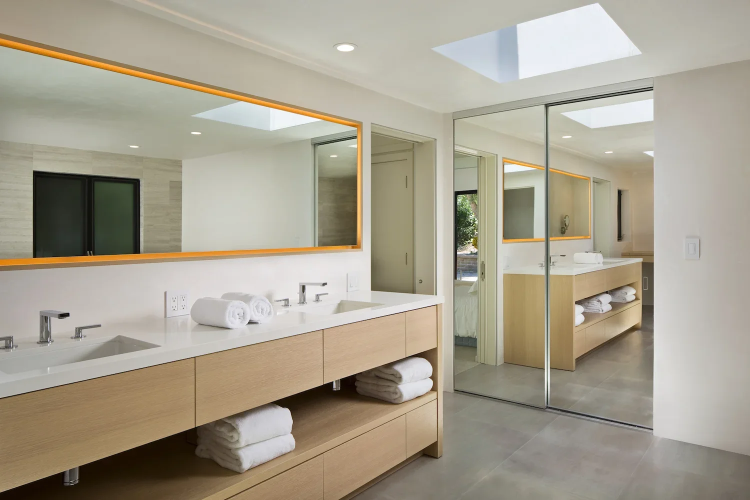 Interior_of_Quail_Carmel_House_Showing_Modern_Minimalist_Bathroom_with_White_Countertops.webp