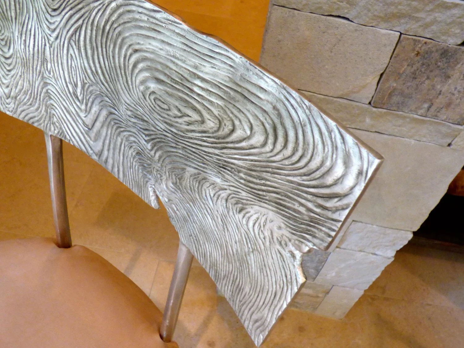 Interior_of_Carmel_By_The_Sea_House_Showing_Chair_With_Beautiful_Wood_Backing.webp