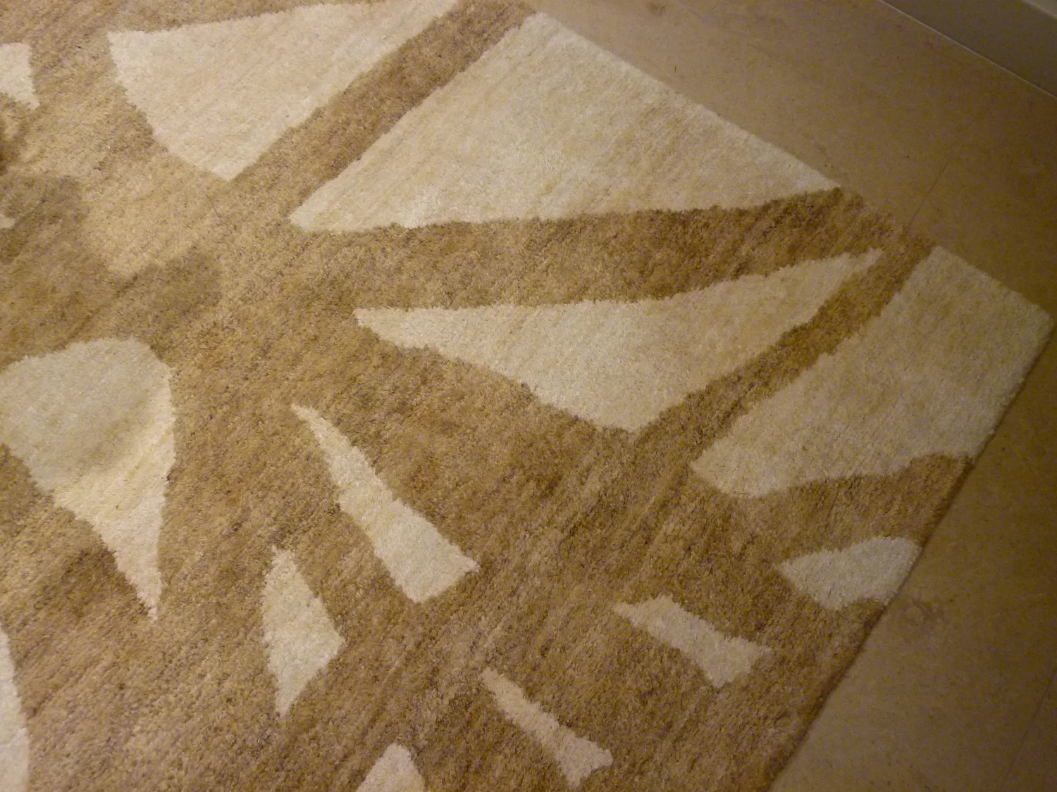 Interior_of_Carmel_By_The_Sea_House_Showing_Sandy_Beige_Brown_Abstract_Carpet.webp