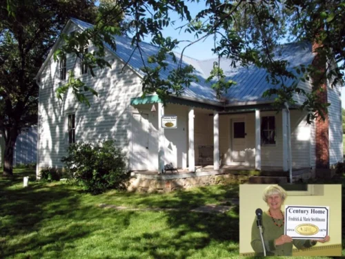 Lois Wyman with her home designated Century home #1 built by Fredrick and Marie Strehlmann circa. 1879.