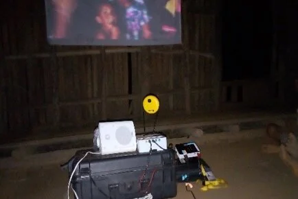 Above: Weighing in at 10kg, the roving cinema kit was used to screen informational videos in villages following the Highlands earthquake.