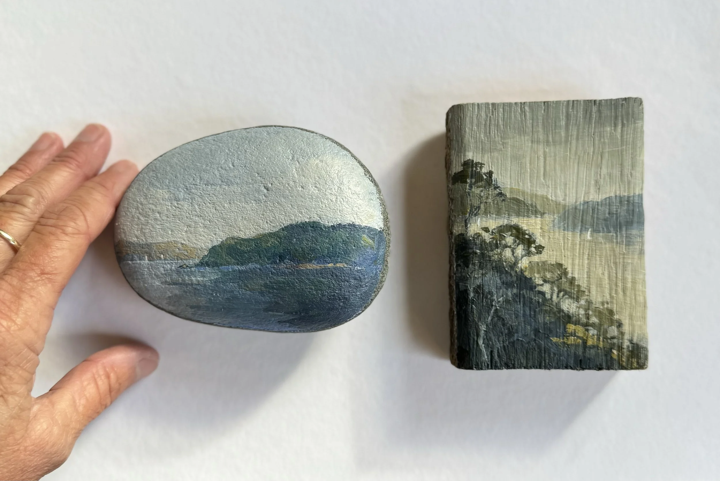 blue pebble and shadopw and hand.jpeg