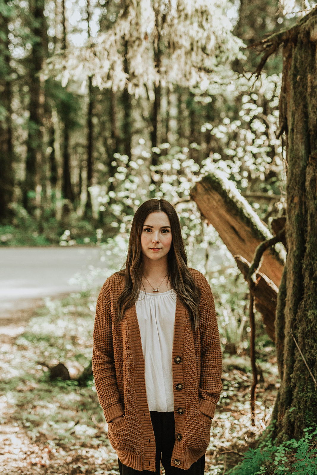 beautiful girl standing in forest