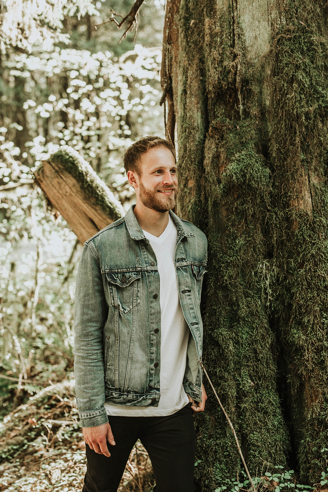 man smiling in forest