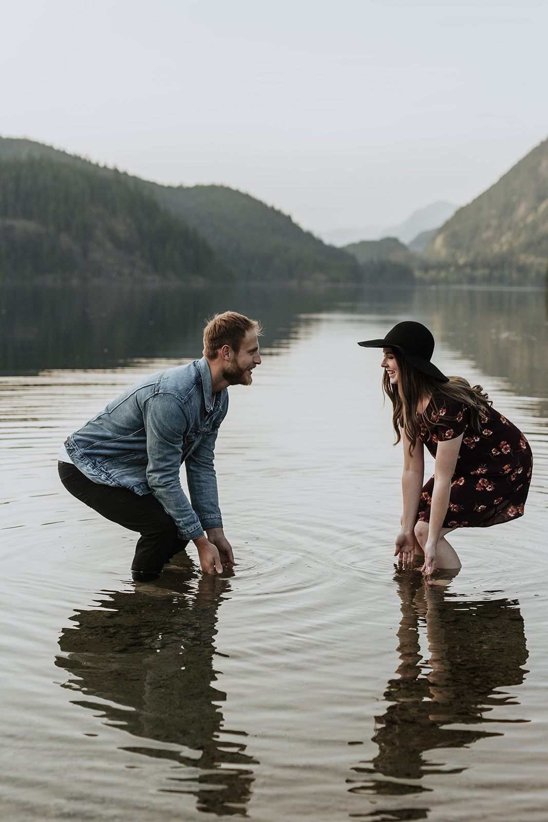 a couple splashing each other