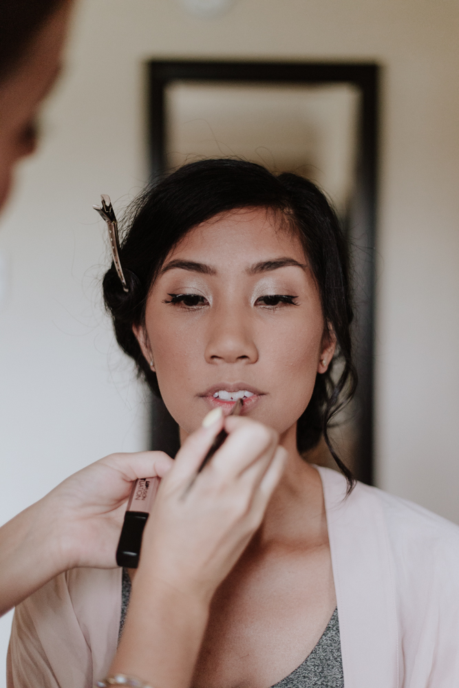 bride getting her makeup done