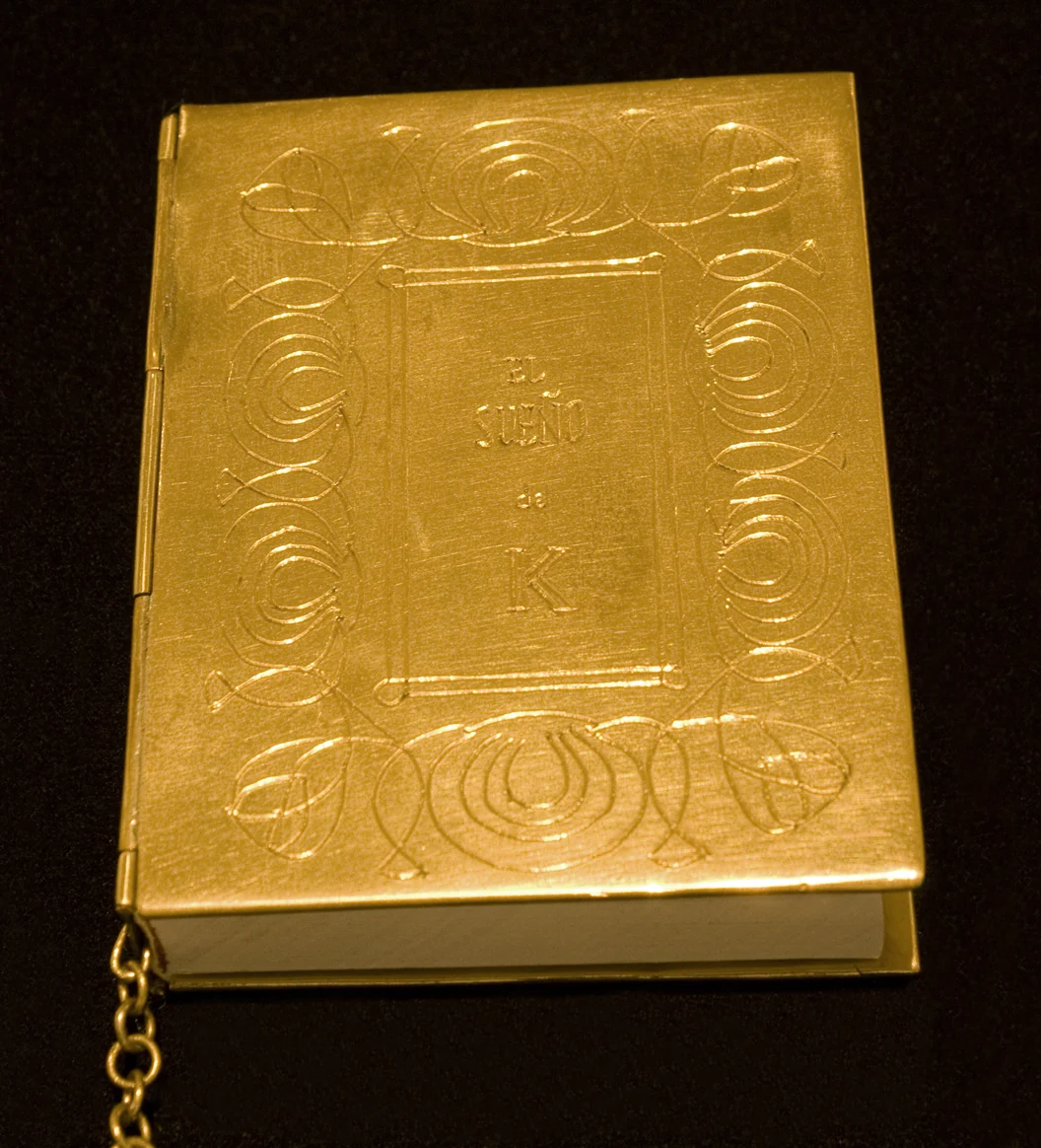    K’ dream. Object Book, Metal cover engraved by hand, printed paper and human hair, 7 x 2.4 x 0.75 in - 8 x 6 x 2 cm. 2011 