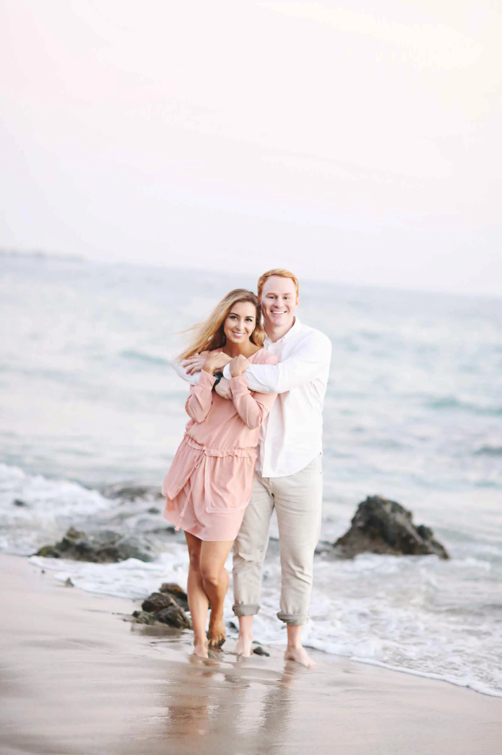 Engagement photo of a couple at an Orange County beach