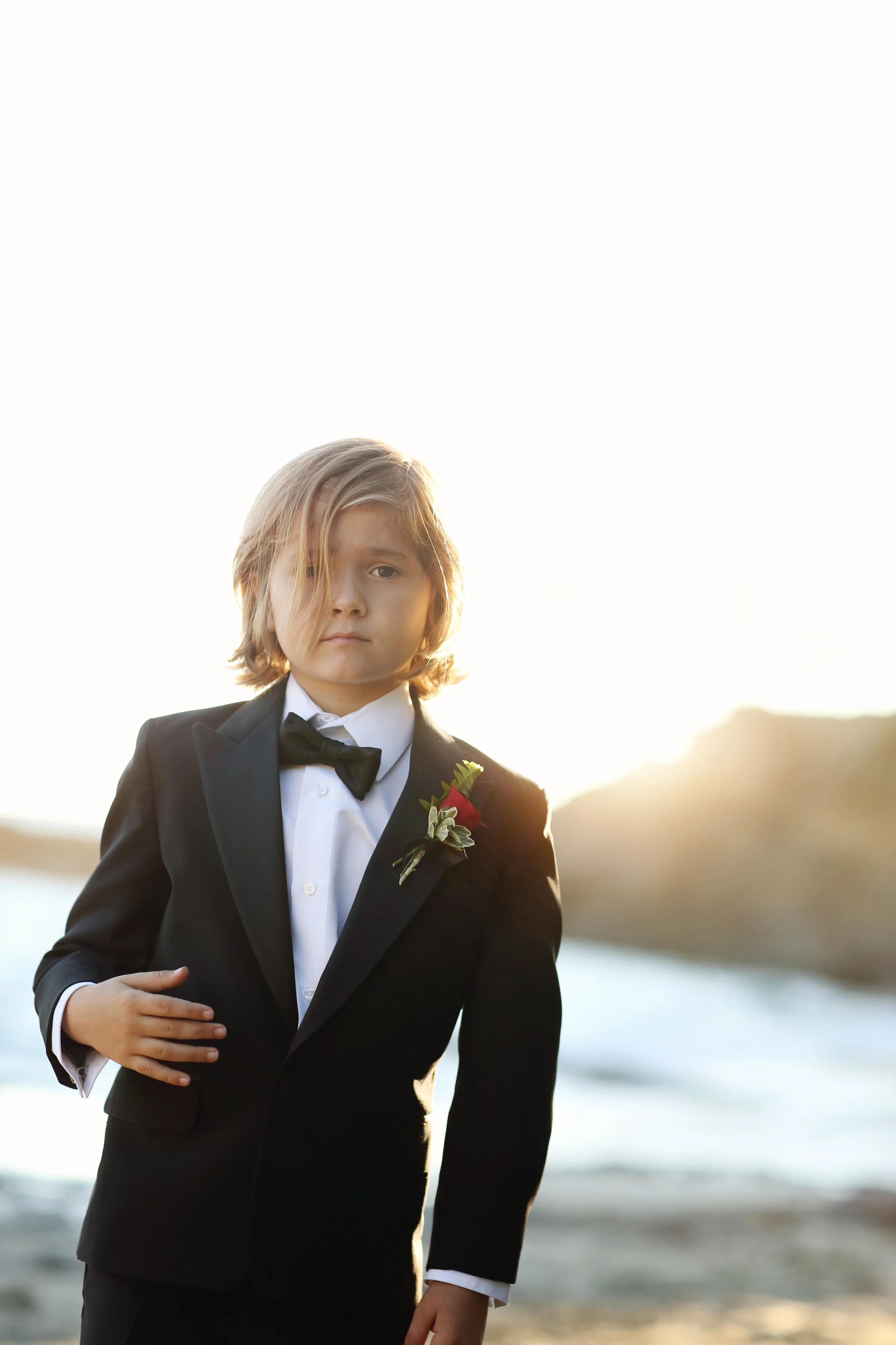 Beach Portrait of young boy in tuxedo at San Clemente Beach. Orange County
