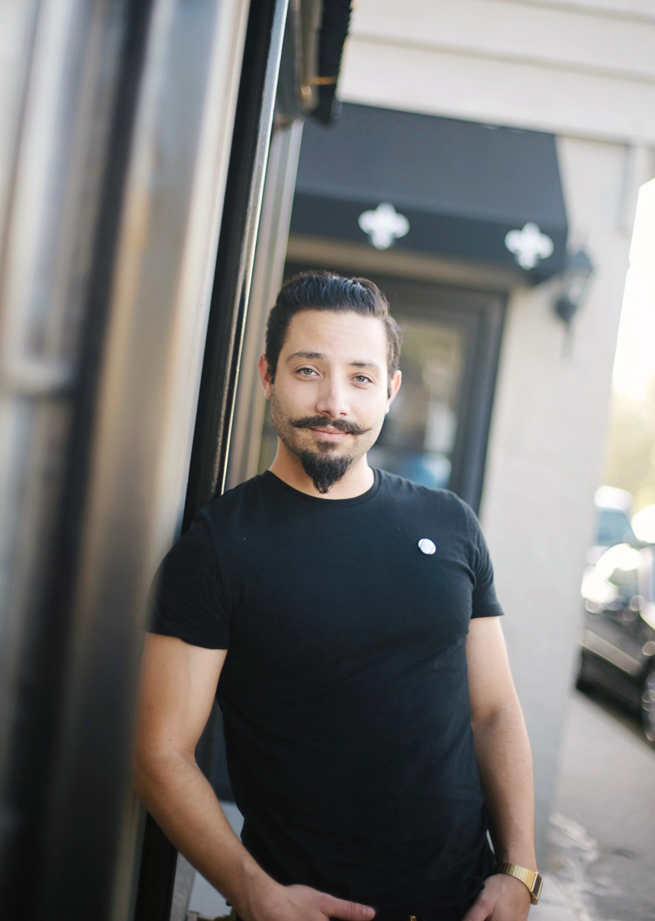 casual portrait of a man with a mustache and beard. In Orange county
