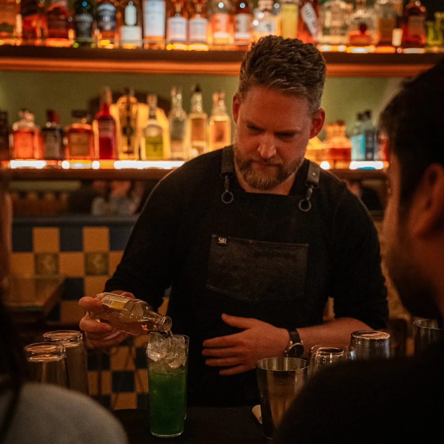 A candid shot of me mastering the art of pouring easily soluble liquids into one another