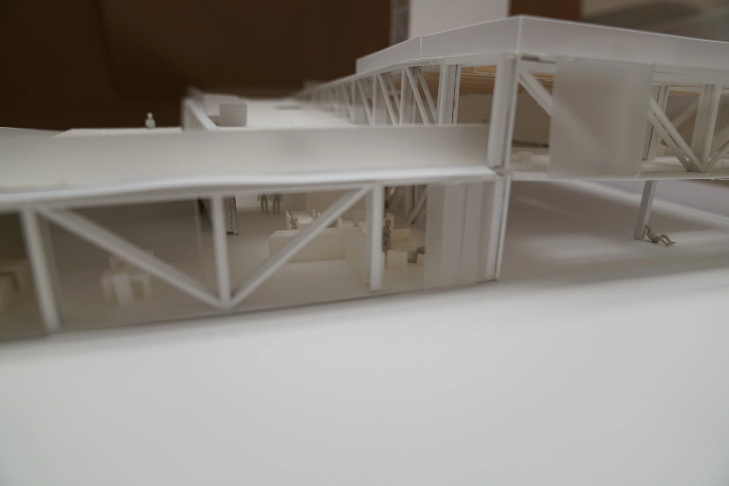  Cafe located underneath the cantilever, allowing for all weather, indoor-outdoor dining, and engaging the economy of the business directly with the urban landscape. 