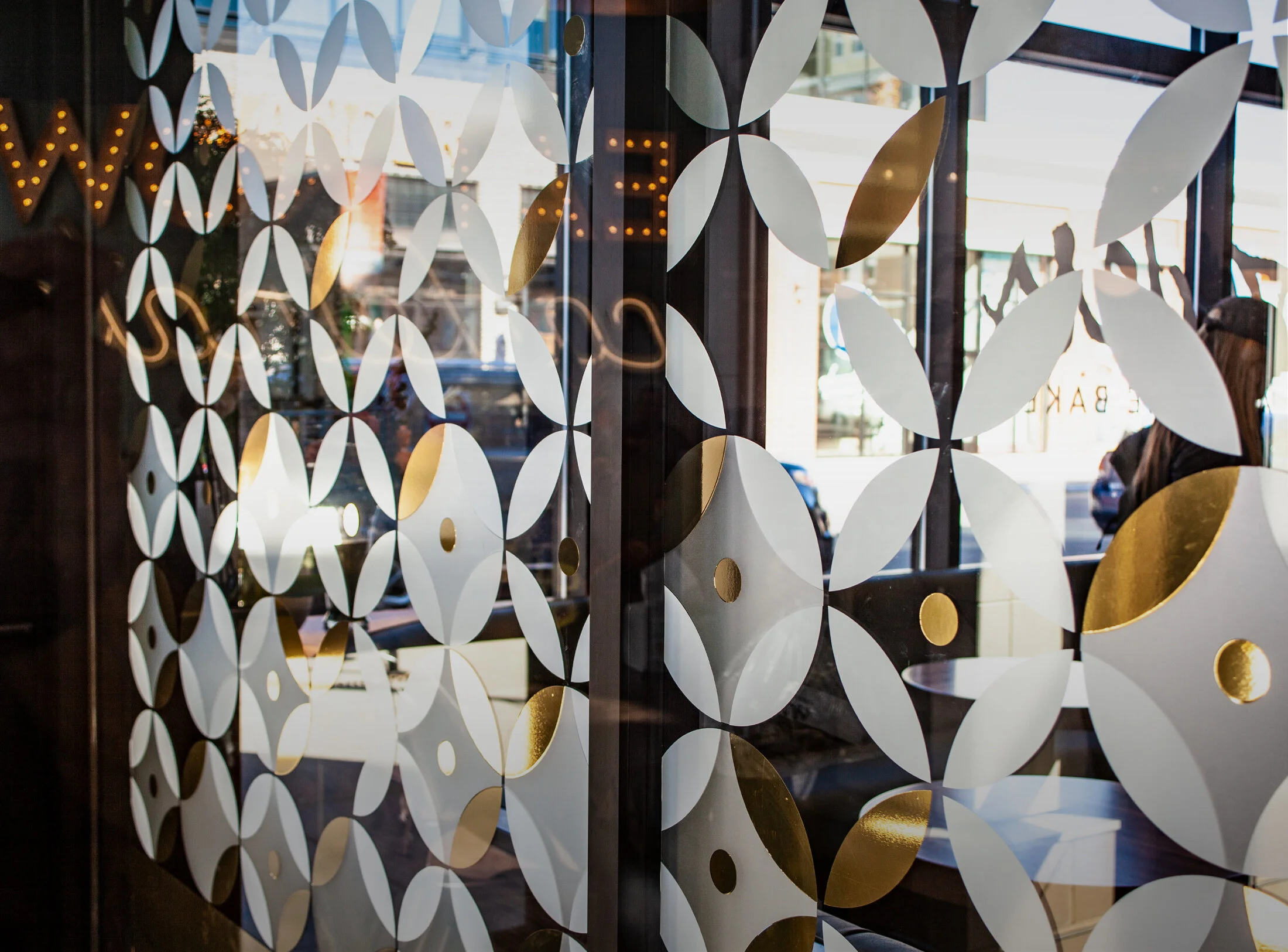  This vestibule pattern was a dream to concept and see come to life. I wanted to play with patterns using different shapes from the soffit but still connect it to the interior space. Part of this location has a unique midcentury petal tile that I dec