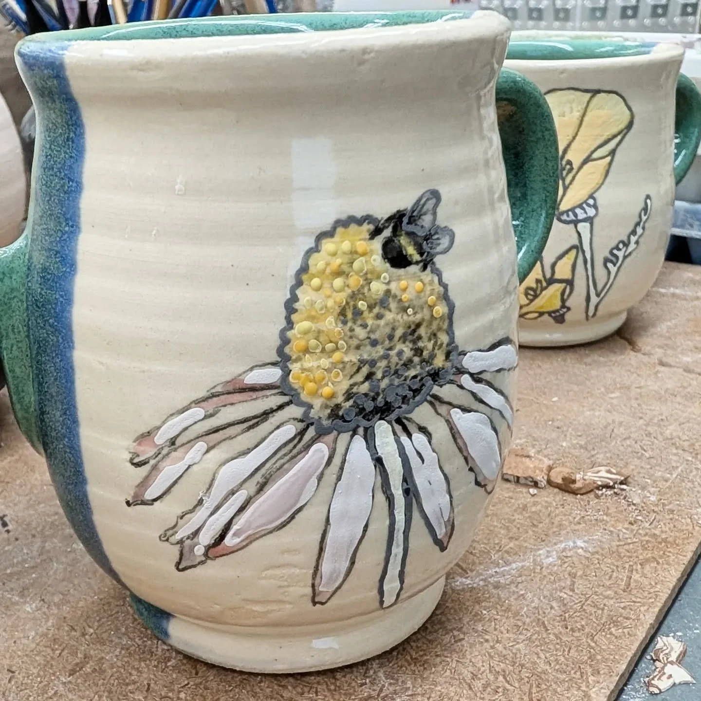 Busy glazing some tea pocket mugs!!