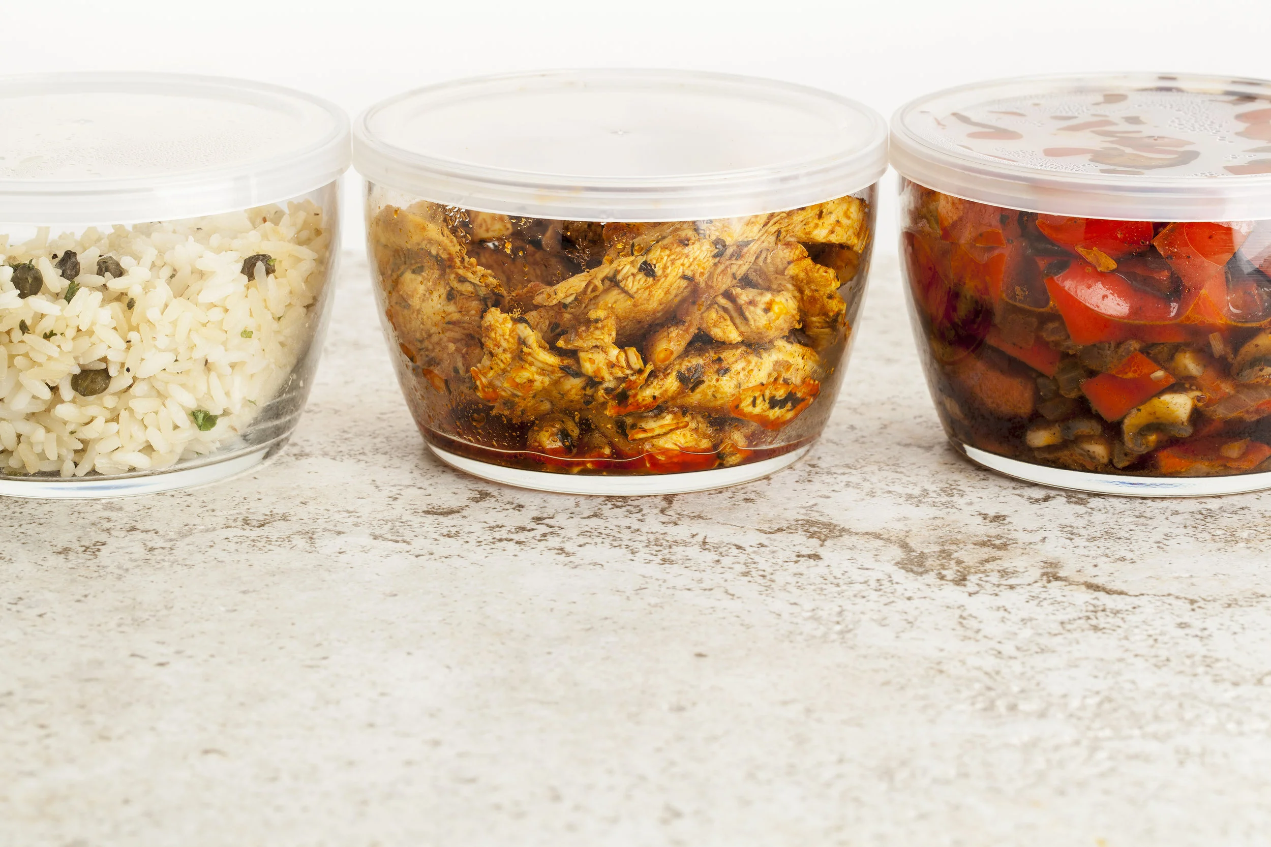 Containers in refrigerator with rice meat and vegetables.jpg