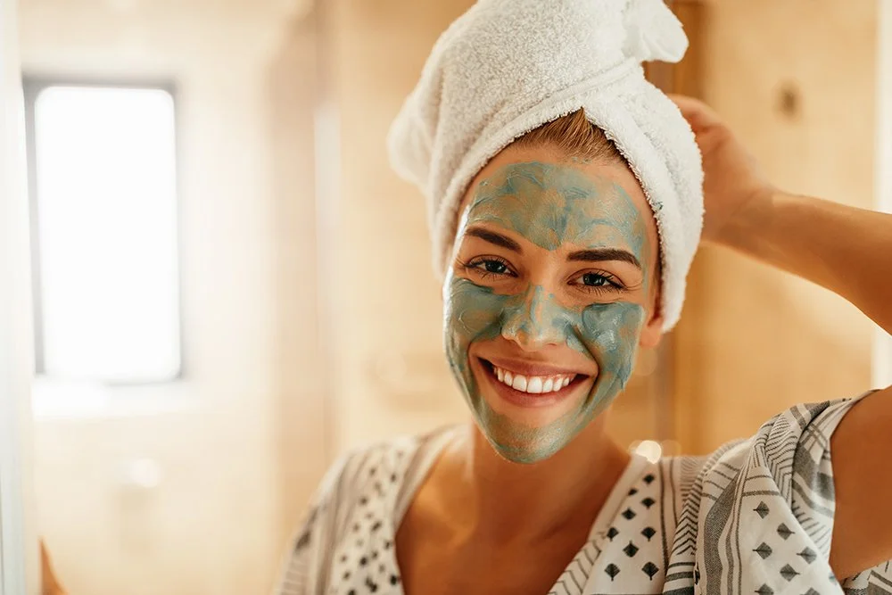Woman-smiling-with-face-mask-on.jpg