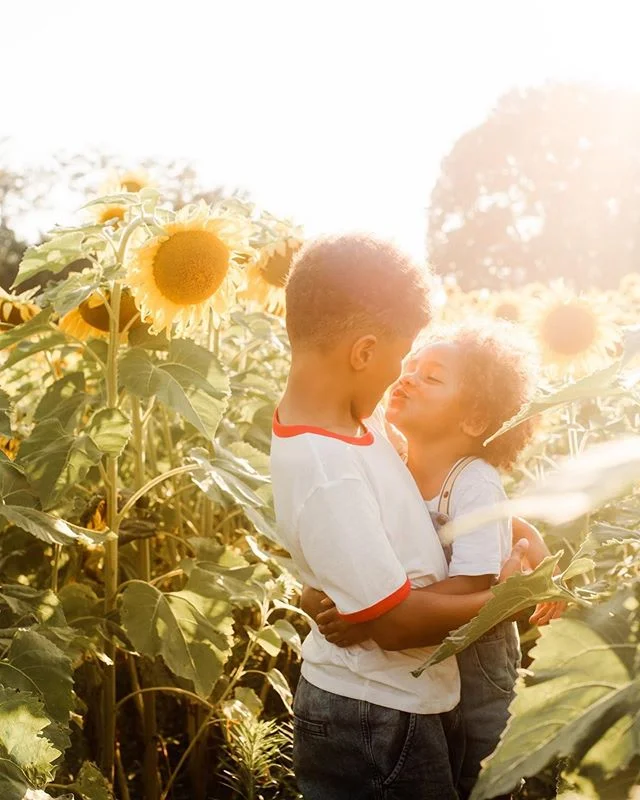 For my birthday this year, I asked my boys for one thing. I asked them to allow me to photograph them in the sunflowers with them giving me real emotion and not hating every minute of them. 
Photographer kid syndrome is a real thing y'all....yes I ge