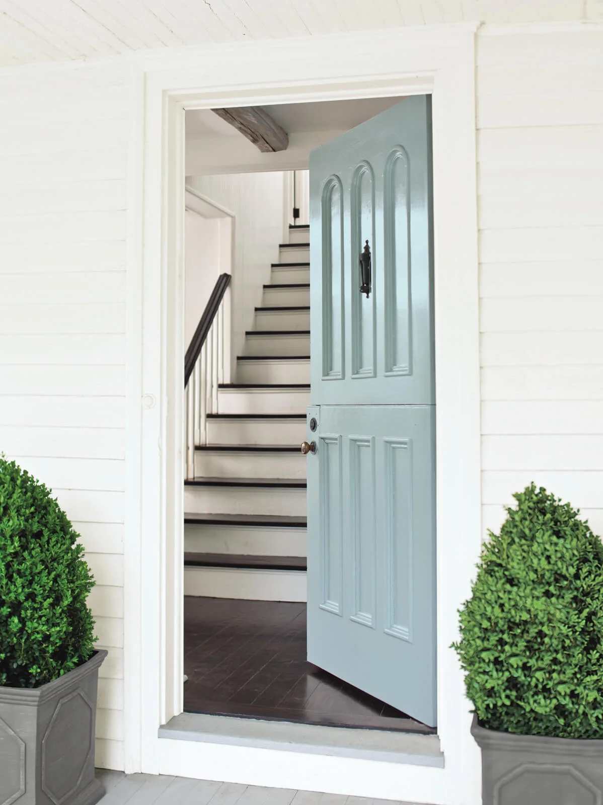 White_Exterior_with_Blue_Front_Door.jpg