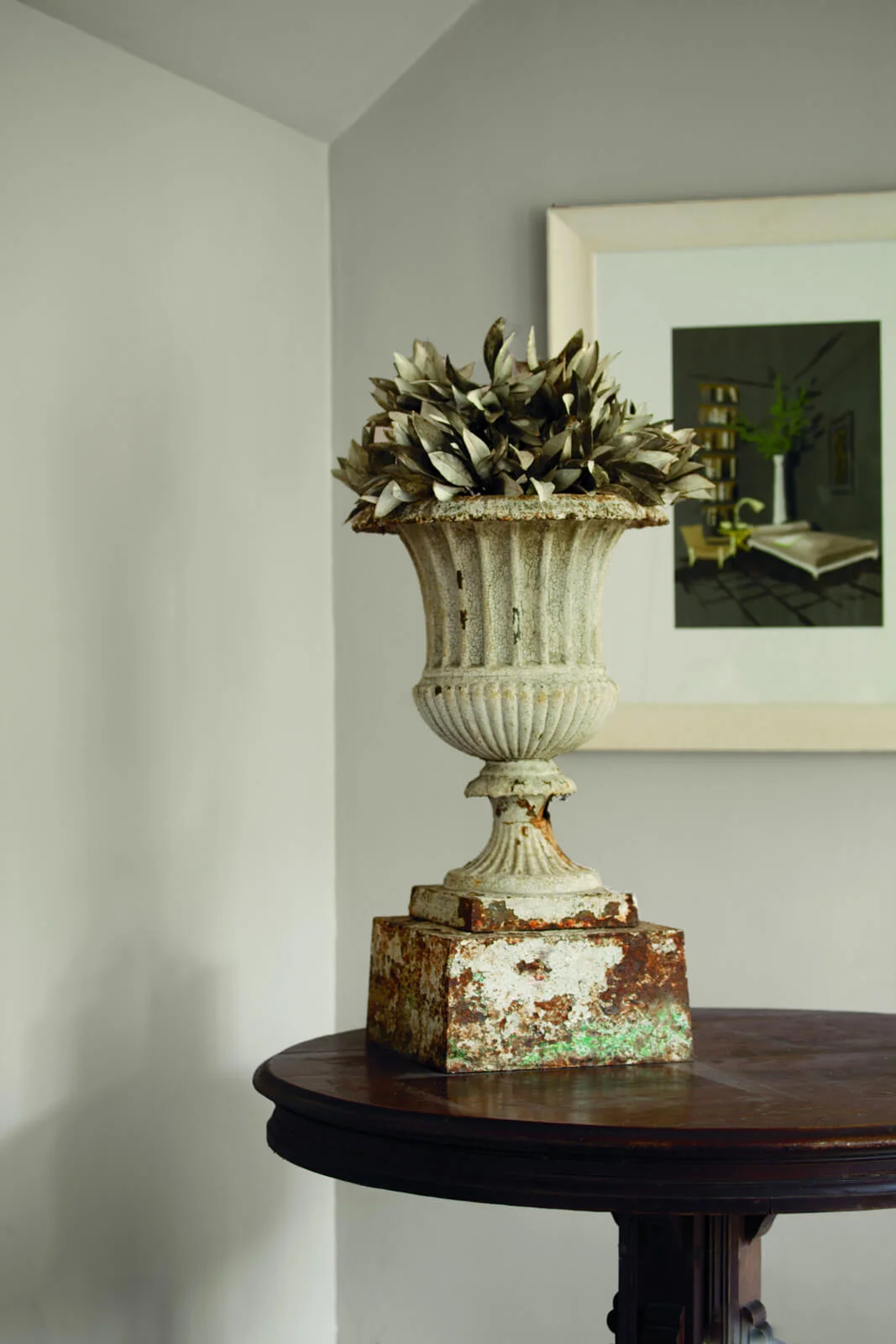 Distressed_Urn_atop_a_Wooden_Table.jpg