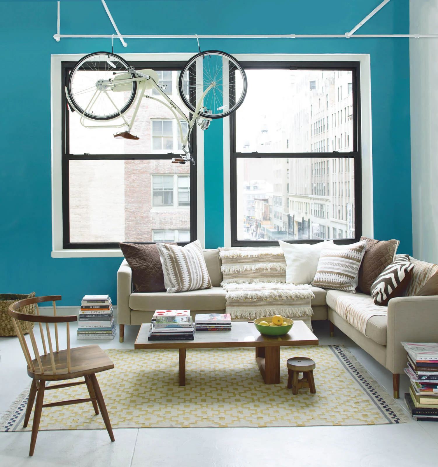 Bold_Blue_Living_Room_with_Hanging_Bike.jpg