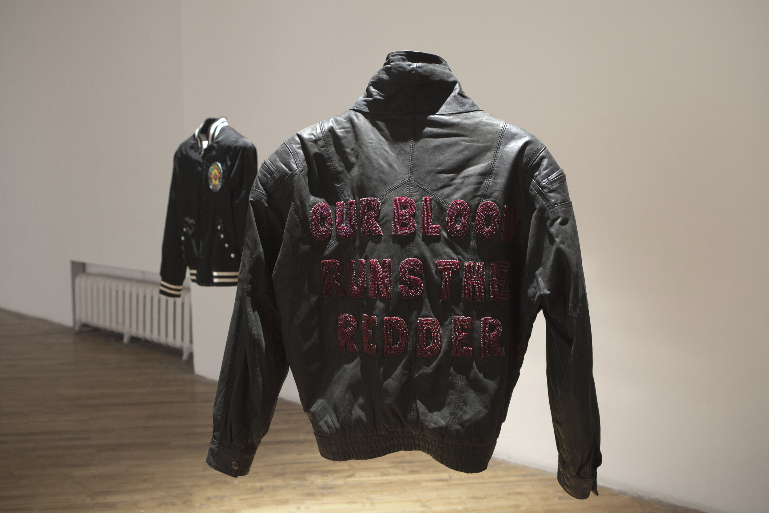   Our Blood Runs the Redder , beaded letters and sinew on thrifted leather jacket, 2018 