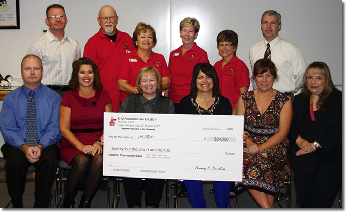 In 2012, the K-12 Foundation presented a total of $24,000 ($3,000 to each school) with the assistance of our major donors . Pictured above are K-12 board members, Lake Havasu School District principals and Superintendent Gail Malay during a district school board meeting. You too, can join us in our efforts by becoming a member online here.