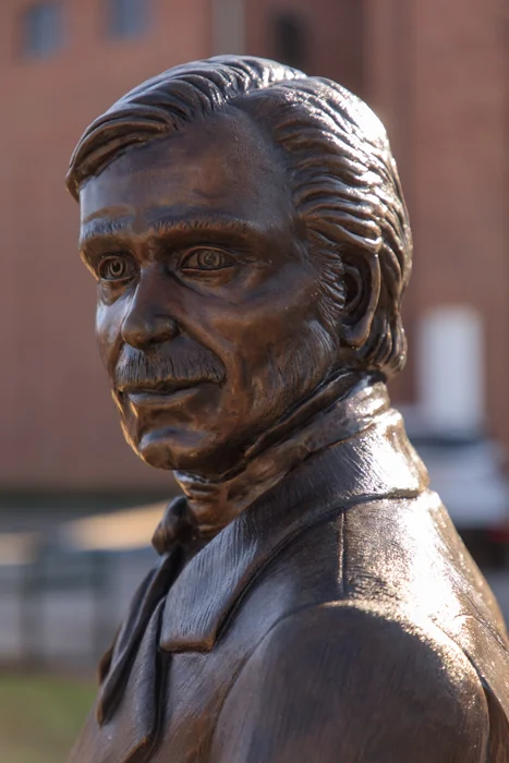A few blocks to the East and a turn South brings me face to face with Mr. William Aiken, the railroad man for whom the town and county were named.