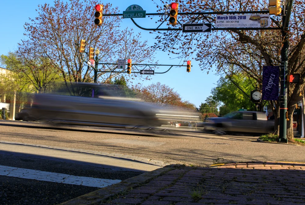 While time may stand still in parts of historic downtown Aiken, the cars don't.