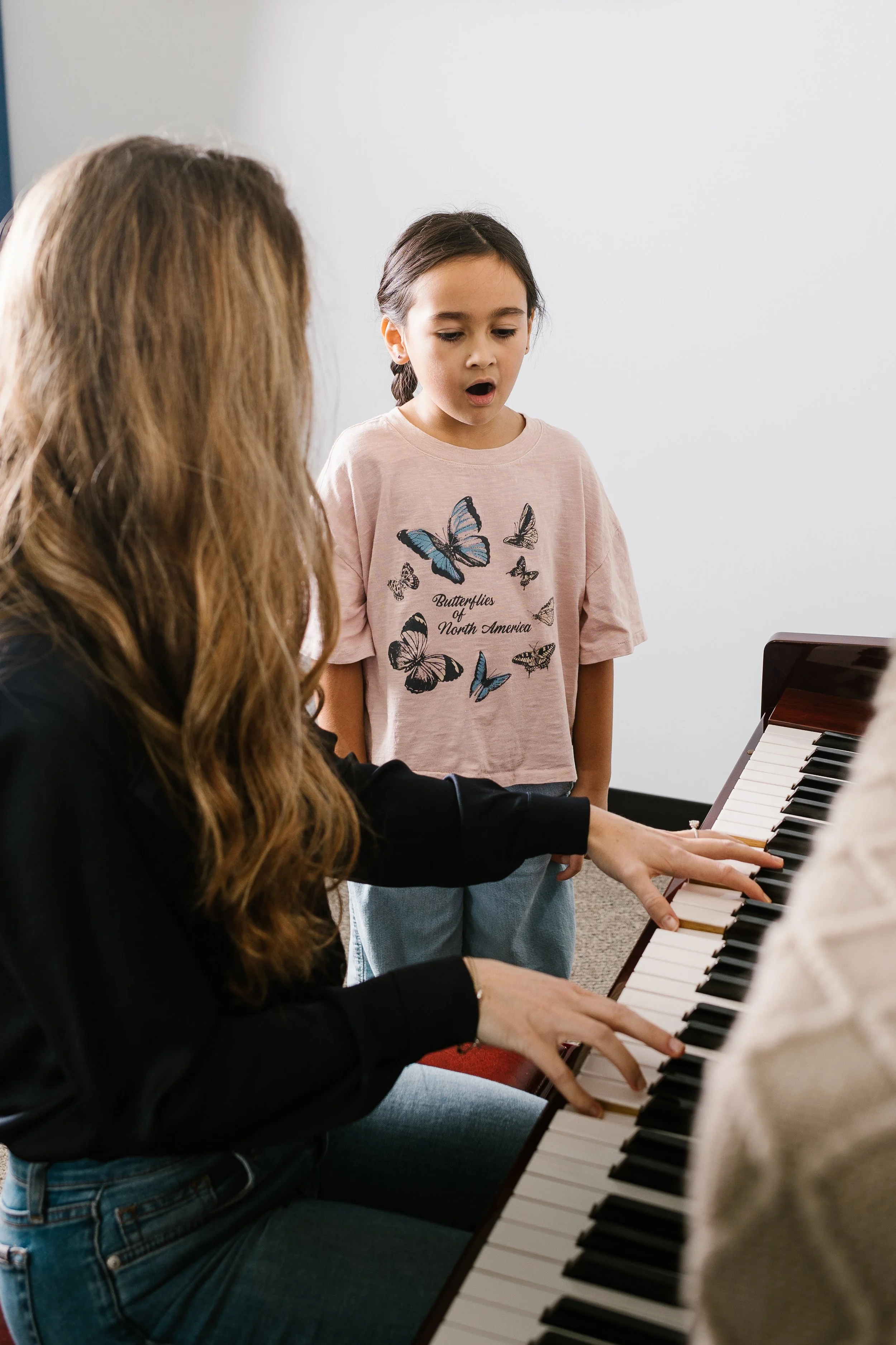 Student-singing-warmups-with-teacher.jpg