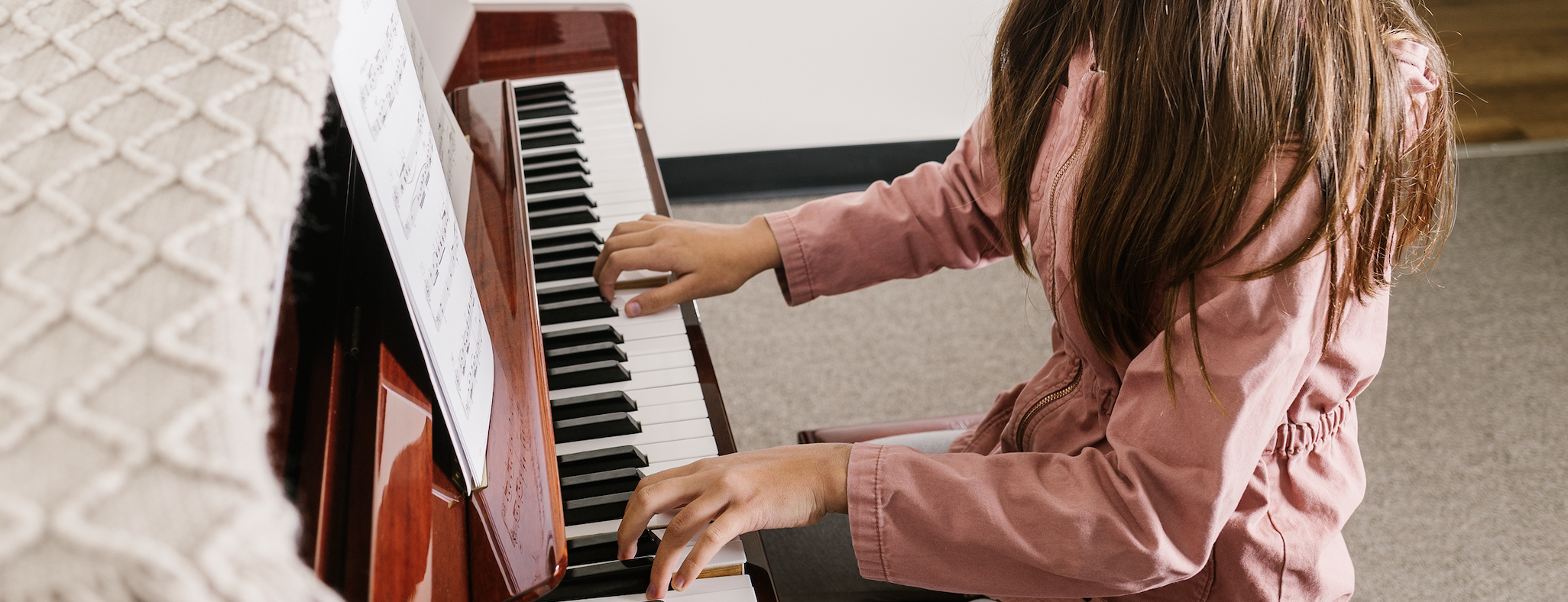 Piano student's hands on keys.png