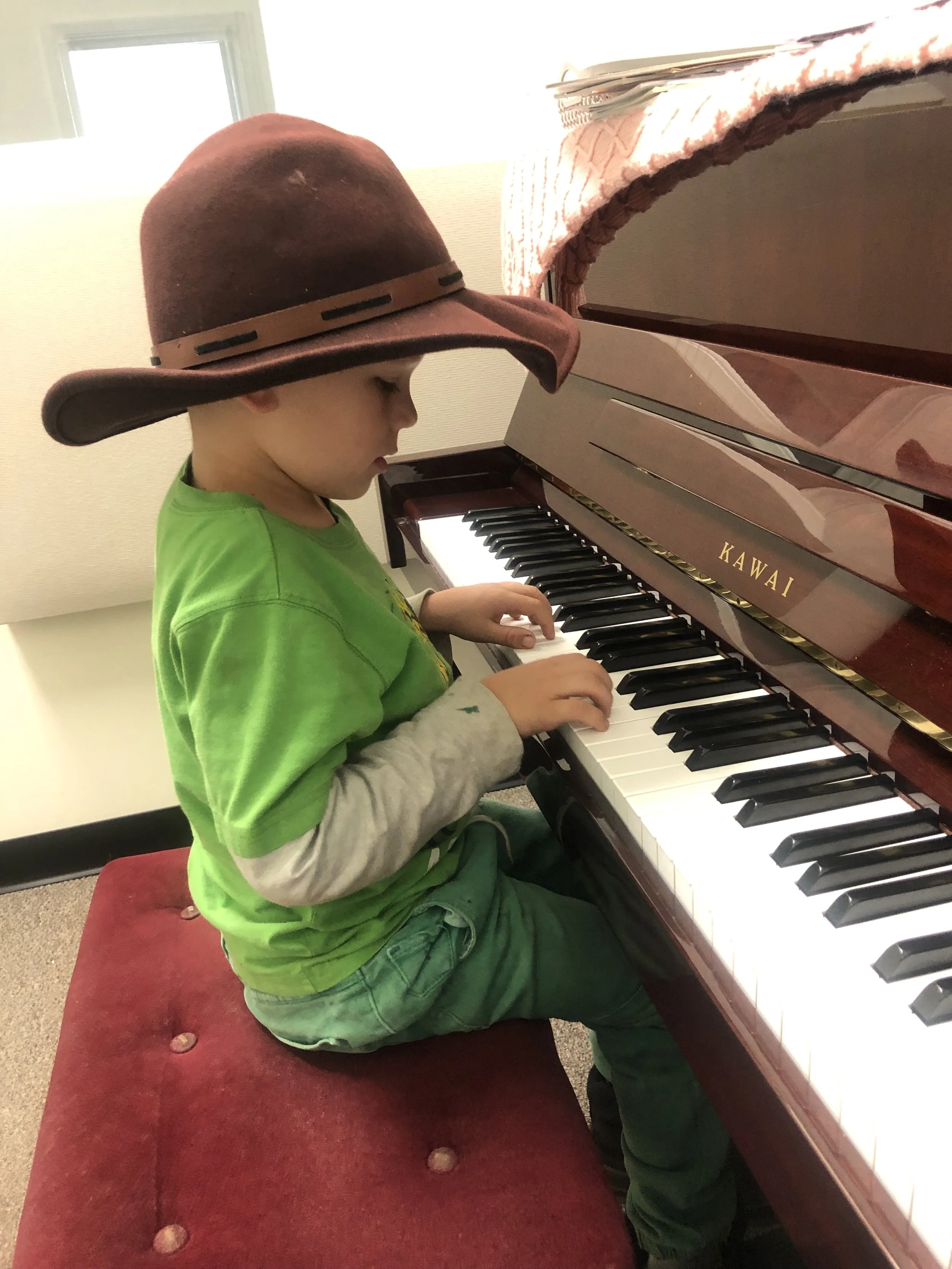 5yr old piano student playing piano.jpg